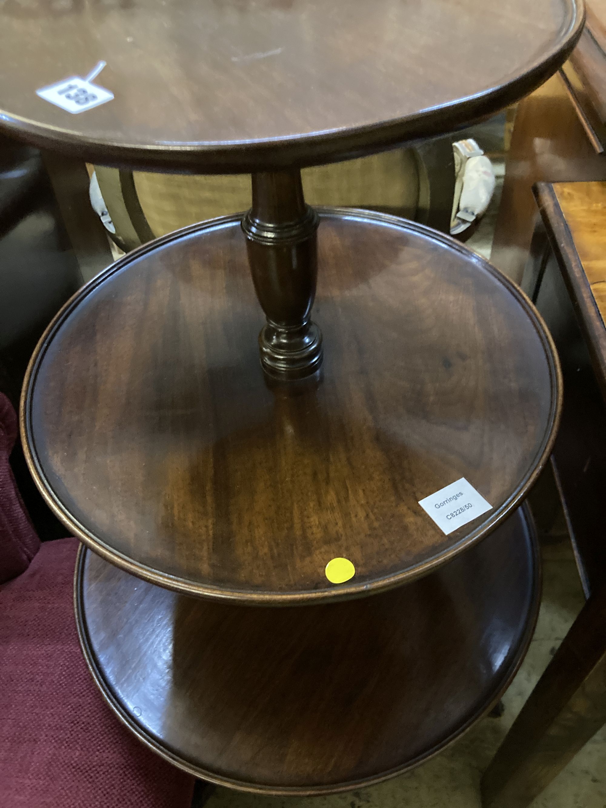 A George III and later mahogany three tier dumb waiter, 54cm diameter, height 108cm